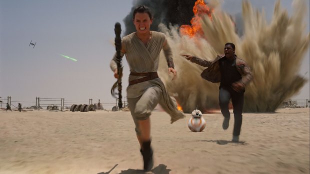 Daisey Ridley as Rey and John Boyega as Finn in <i>Star Wars: The Force Awakens</i>.