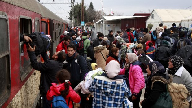 Refugees arrive by train at the transit centre for refugees near the northern Macedonian village of Tabanovce, before continuing their journey to Serbia. 