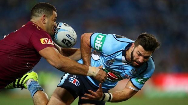 Oops: James Tedesco loses the ball in a tackle by Greg Inglis.