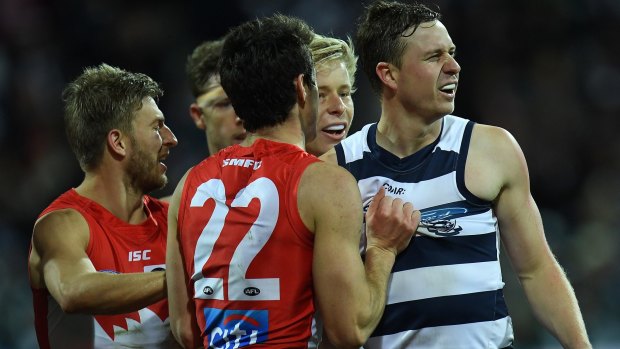 The Swans remonstrate with Geelong's Mitch Duncan, who has now been suspended.