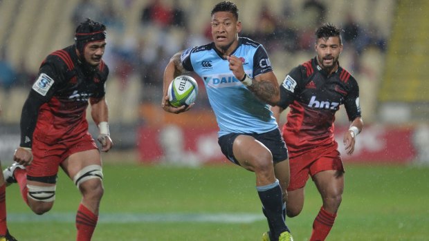 Full flight: Israel Folau carves up the Crusaders' defence to score.
