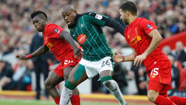 Shock draw: Liverpool's Sheyi Ojo, left, battles for the ball with Plymouth Argyle's Paul Arnold Garita during their FA Cup draw at Anfield.