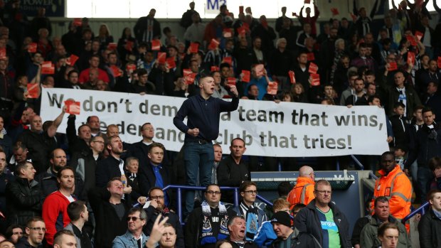 Newcastle fans protest after the game against Leicester City.
