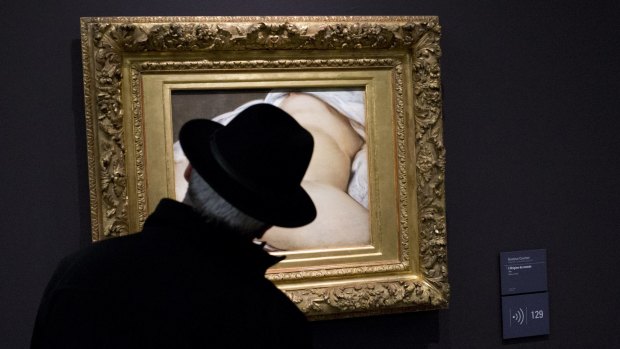 Nude painting ... A visitor looks at Gustave Courbet's 1866 work 'The Origin of the World,' which depicts a vagina, at Orsay museum in Paris, France.
