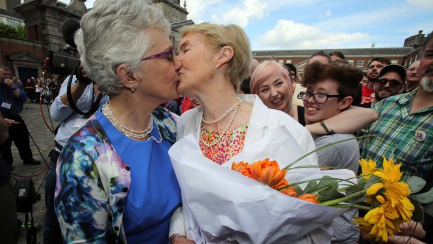 Irish senator Katherine Zappone (left) kisses her partner Ann Louise Gilligan at the Dublin Castle celebration.