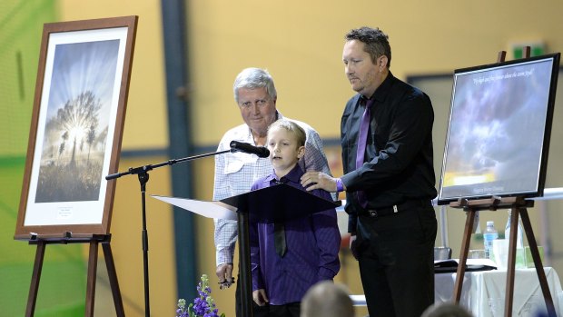 Younger brother Brandon Morrissey speaks, accompanied by Jayde's father Bruce and grandfather Denis.
