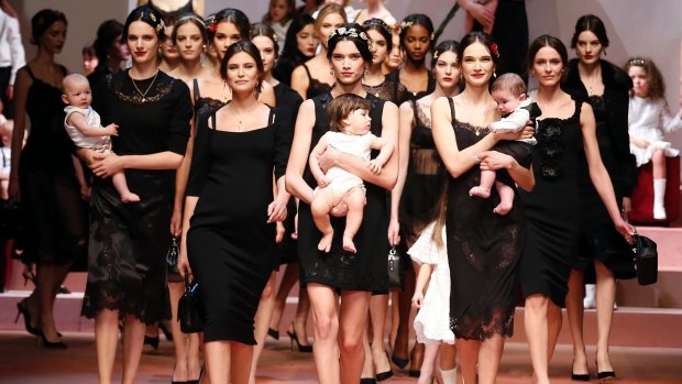 Dolce & Gabbana presented a baby-filled finale at their Milan fashion week show.