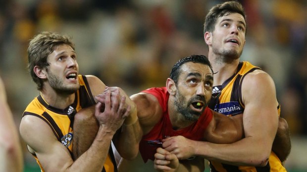 Sidelined by ankle injury: Grant Birchall (left) - seen competing with Adam Goodes for the ball - will miss the match against the Adelaide Crows.