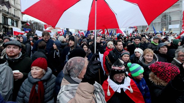 Tens of thousands of Poles angered by an ongoing constitutional conflict march in Warsaw, Poland, last month.