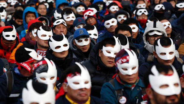 South Korean protesters attend an anti-government rally in downtown Seoul last month.