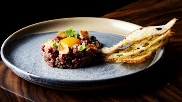 Rustic, hand-chopped lamb tartare at 6 Head.