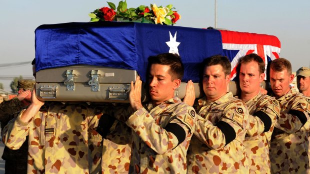 Members of the Australian Defence Force and coalition partners from the International Security Assistance Force bid farewell to Australian Army Aviator Lieutenant Marcus Case at a memorial and ramp ceremony at Kandahar Airfield.