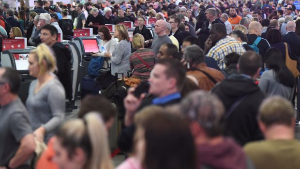 Waiting game: Huge queues at Sydney Airport.