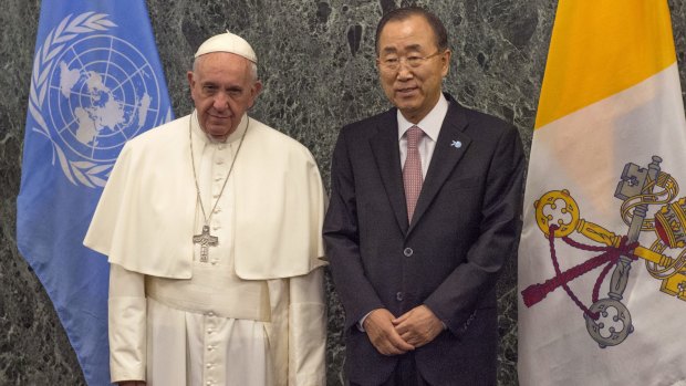 Pope Francis and the Secretary-General of the United Nations Ban Ki-moon pose for photographs at the UN headquarters, Friday.