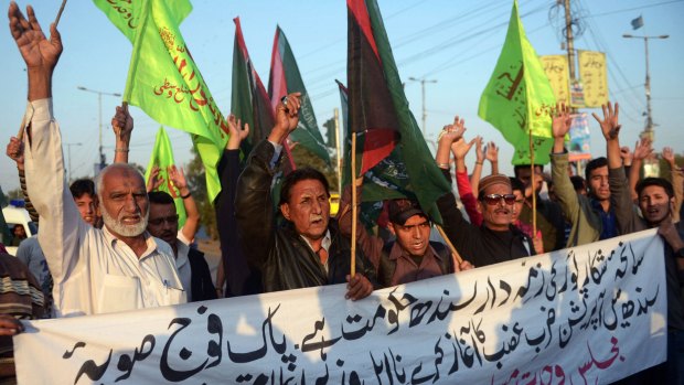 Pakistani Shiite Muslims in Karachi protest the attack.