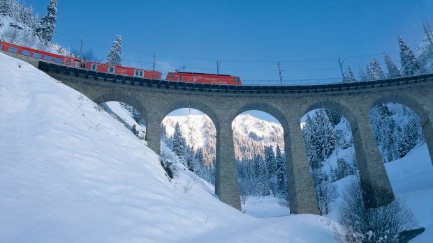 Admire the scenery over a drink on the red Apres-Ski Train of the Matterhorn Gotthard Bahn.
