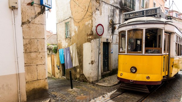Lisbon's classic No. 28 tram en route through the Alfama district.