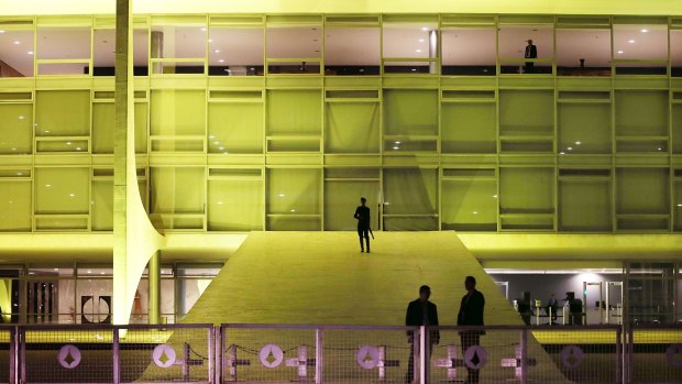 Security officers stand guard outside the Planalto presidential palace in Brasilia on Tuesday.