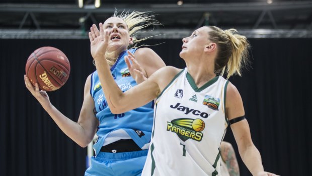 Lauren Jackson of the Canberra Capitals takes on Dandenong Rangers defender Penny Taylor on Sunday.