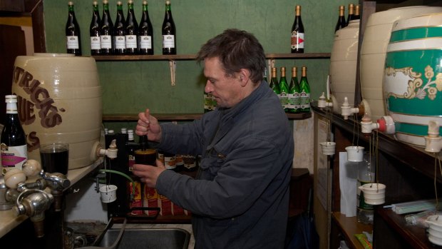 A man pours cordial drinks at Fitzpatrick's, Britain's last temperance bar. 