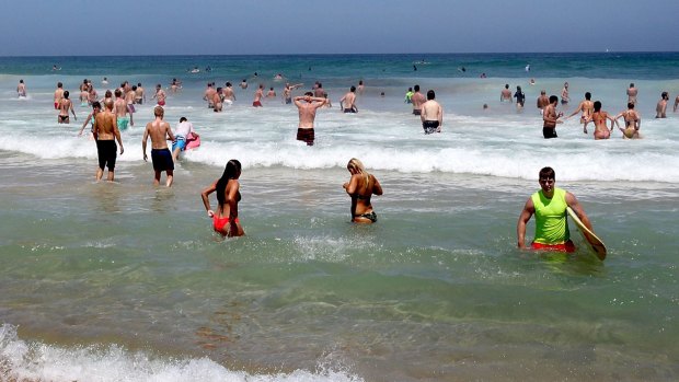People enjoying New Year's Day at Bondi Beach.