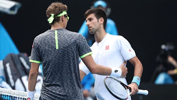 Djokovic congratulates Istomin.