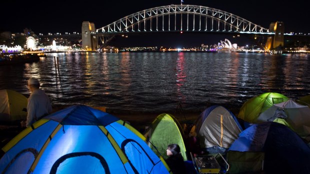 People camp out at Blues Point Reserve to secure a spot ahead of New Year's Eve celebrations.