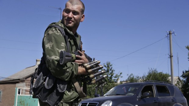 A pro-Russian rebel holds ammunition in the village of Hrabske, eastern Ukraine.