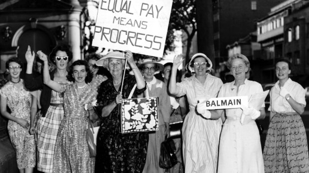 Women unionists wave to a Herald Photographer outside Parliament House in 1958. They were to have held a demonstration demanding equal pay but instead held a rally to congratulate Premier Cahill. 