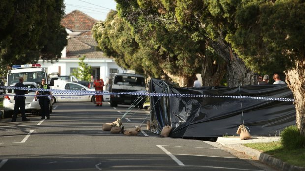 A black tarpaulin was put up around the scene on Monday.
