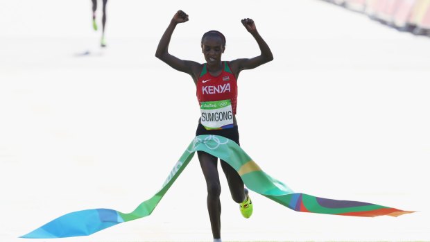 Making history: Jemima Jelagat Sumgong of Kenya crosses the finish line at the Rio 2016 women's marathon.
