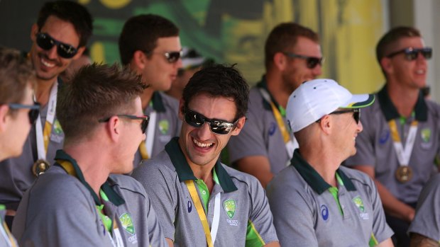 Mitch Starc shares a joke with James Faulkner at Federation Square on Monday.