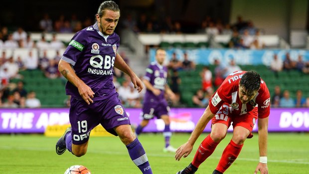 Joshua Risdon of Perth Glory gets past Bruno Fornaroli of Melbourne City during the round 15 A-League match on Saturday.
