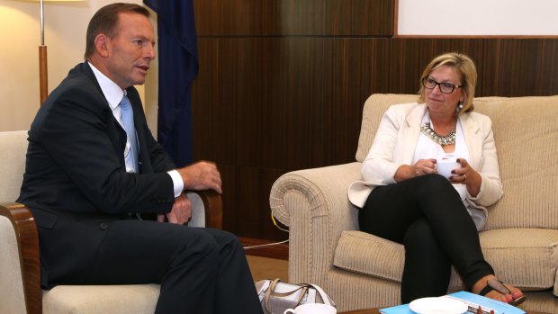 Prime Minister Tony Abbott speaks with anti-family violence advocate and 2015 Australian of the Year, Rosie Batty.