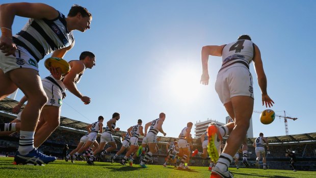 Geelong players take the field before their game against the Brisbane Lions.