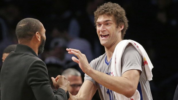 Scraped in: Brooklyn Nets centre Brook Lopez celebrates with injured guard Alan Anderson.  The Nets defeated the Magic 101-88. 