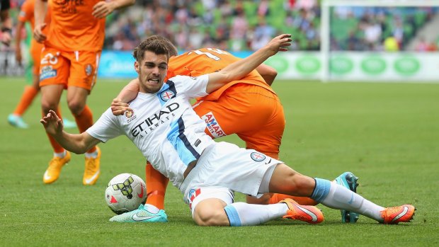 Daniel Bowles of Roar and Ben Garuccio of City contest the  ball at AAMI Park on Sunday.