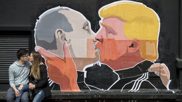 A mural on the walls of a bar in Vilnius, Lithuania, depicts Russian President Vladimir Putin and Republican President-elect Donald Trump kissing.