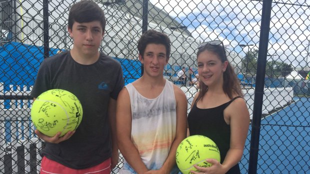 Ryan Sharkey, 17, Peter Derome, 15, and Serena Sharkey, 15, gather signatures from the stars in the lead-up to the Brisbane International.