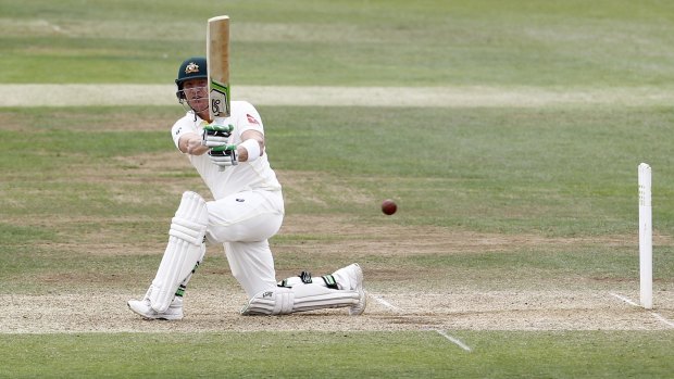 Plans to play on despite missing selection ... Brad Haddin belts a ball during the tour match against Derbyshire.