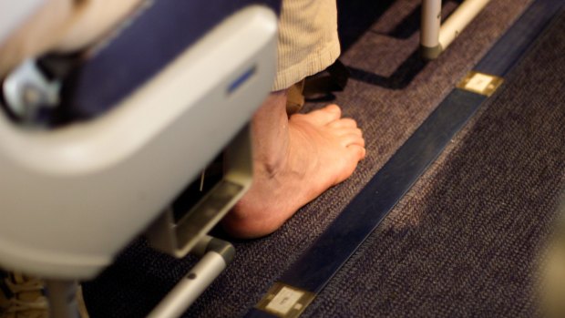 What possesses people to take their shoes and socks off on planes?