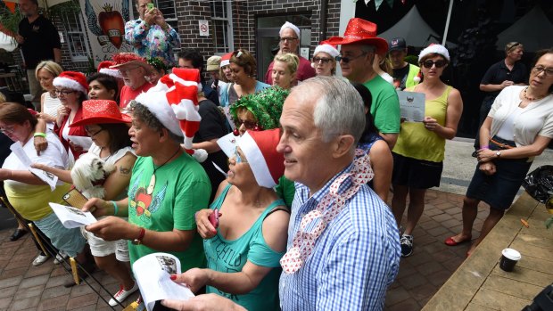 Jollier times: Prime Minister Malcolm Turnbull celebrates Christmas at the Wayside Chapel in 2015.