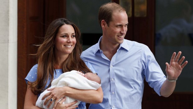Britain's Prince William and Kate, Duchess of Cambridge hold their new born son George in 2013. Their second baby is due in mid-to-late April.
