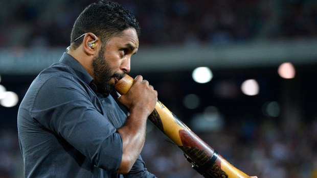 Elder statesman: Preston Campbell plays the didgeridoo before the NRL All Stars Game at Suncorp Stadium in 2013.