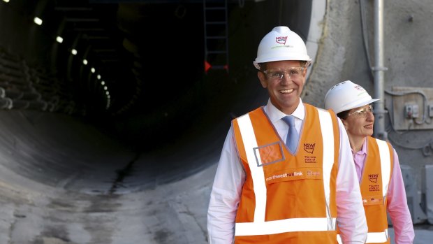 Hard hat approach: Mike Baird and Gladys Berejiklian on the campaign trail. 