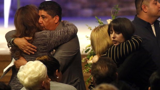 Jose Hernandez, second left, stepfather of Nohemi Gonzalez, a victim of the Paris attacks, attends her funeral in Downey, California, on Friday.