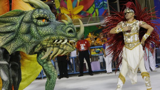 Performers from the Estacio de Sa samba school, whose theme this year is a tribute to St Jorge, parade during Carnivalat the Sambadrome in Rio de Janeiro, Brazil, on Sunday.