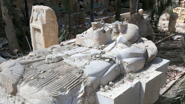 A destroyed statue outside the damaged Palmyra Museum, in Palmyra - the town taken back from Islamic State by the forces of Bashar al-Assad on the weekend. 
