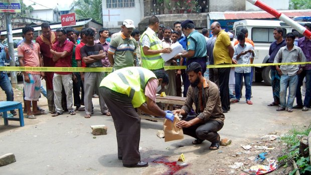 Bangladesh forensics police investigate the site where blogger Ananta Bijoy Das was hacked to death by a masked gang wielding machetes, in Sylhet.