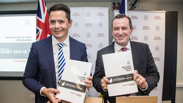 Western Australia Treasurer Ben Wyatt and Premier Mark McGowan open the state budget papers.